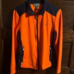 Lauren Ralph Lauren Active LRL women's full-zip jacket in orange and navy blue.